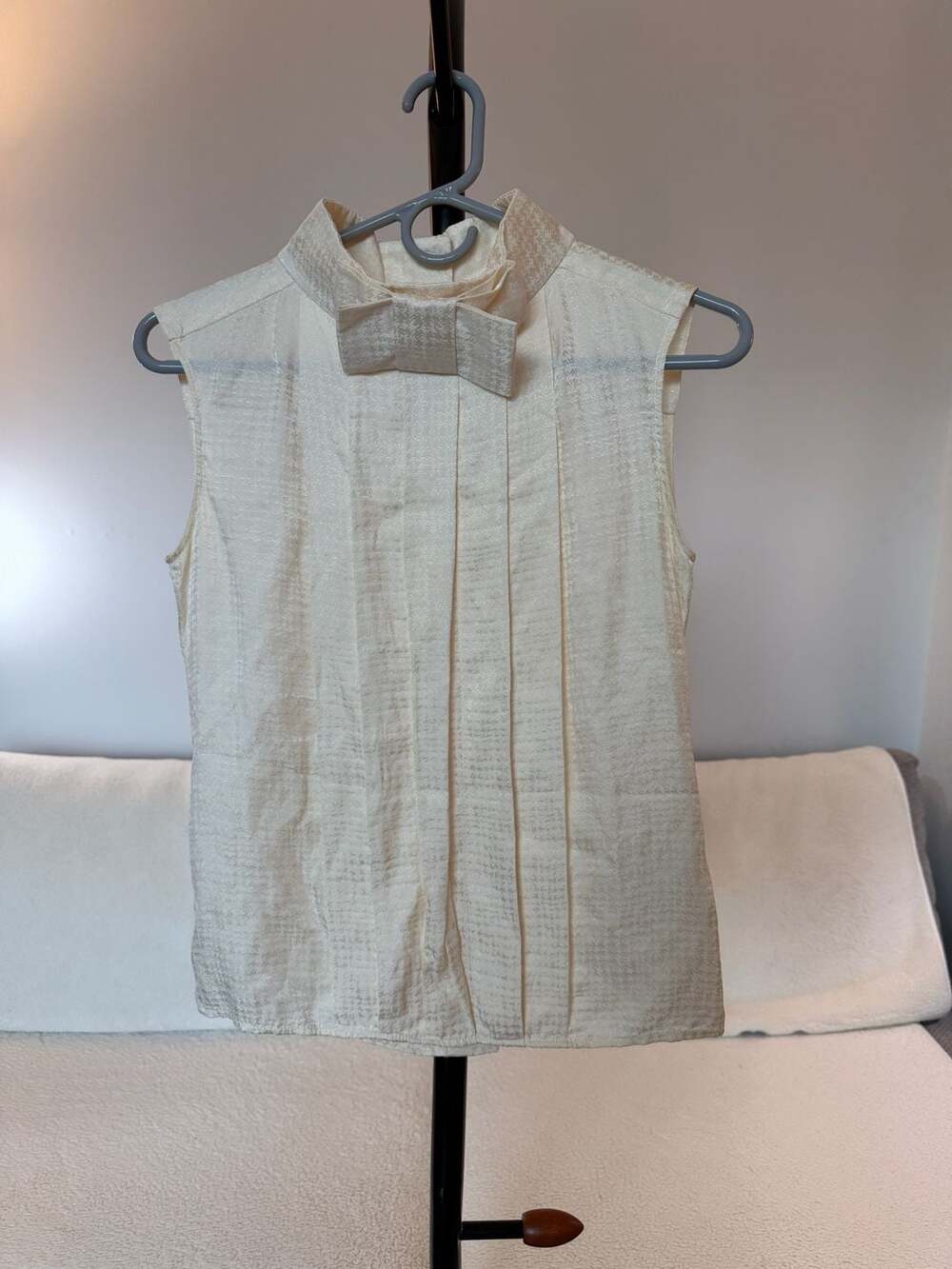 Designer Silk Pleated Sleeveless Blouse with Bow Collar and CC Globe Buttons